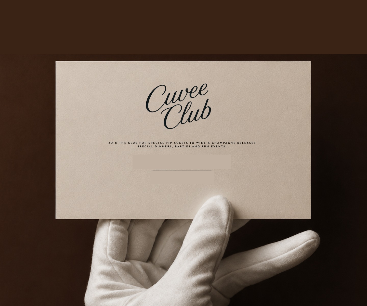 A white-gloved hand presenting the Cuvee Club card